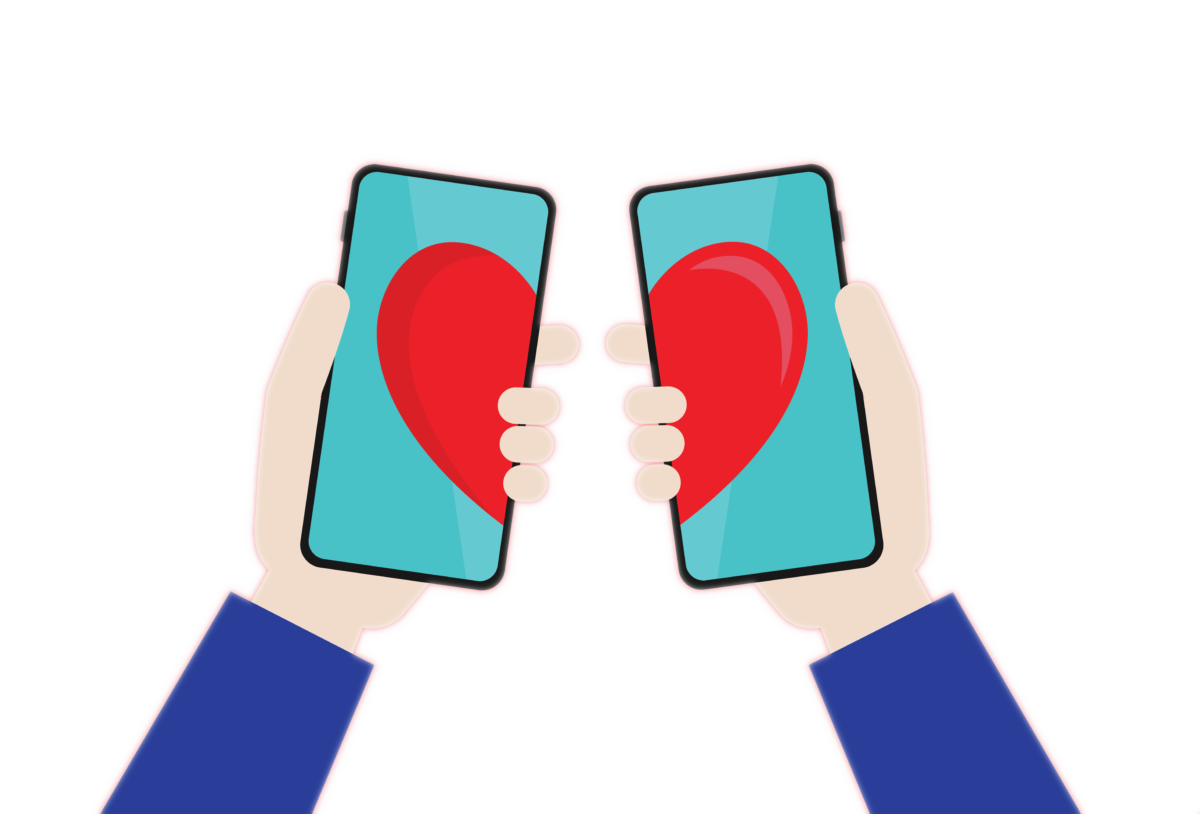 A pair of hands holding two cell phones that each display half of a heart.